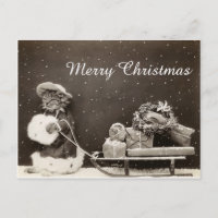 Vintage-Weihnachtskatze mit Schlitten und Kranz