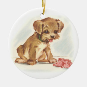 Vintage-Welpe bewundert neue Babyschuhe Keramikornament