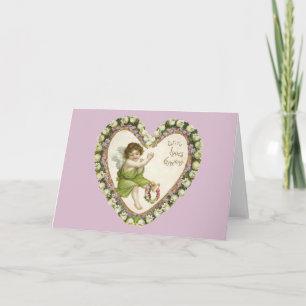 Vintager Cherub mit floraler Herzkarte Feiertagskarte