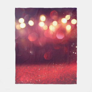 Vintager Hintergrund des roten Glitzer defokusedba Fleecedecke