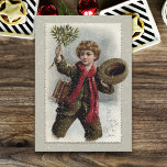 Vintager Junge im Schnee mit fröhlichen Weihnachts Feiertagskarte<br><div class="desc">Guter Vintager Schuljunge mit lockenhaarigen Haaren,  der durch den Schnee geht und seinen Hut kippt und mit fröhlichen Weihnachtsgrüßen einen Haufen Misteloe schwänzt.</div>