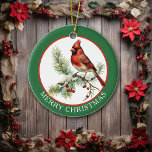 Vintager Kardinal Bird Joy to World Keramik Ornament<br><div class="desc">Ein Vintage-Bild eines Rot-Kardinal-Vogels, der auf einem roten Kiefernhain sitzt, ist das Feature dieses hübschen Retro-Stils Holiday-Ornament. Das Bild ist in dünnen Rot gerahmt, und auf einer grünen Grenze, die "MERRY CHRISTMAS" in Weiß. Die Rückseite des Ornaments hat das gleiche Bild, aber mit Text, der "JOY TO THE WORLD" sagt....</div>