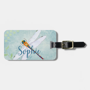 Vintager Libellenfliege im Hintergrund verblasster Gepäckanhänger