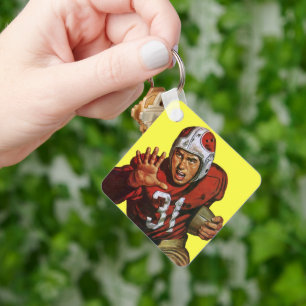 Vintager Sportfußball-Spieler, der auf der Rücksei Schlüsselanhänger