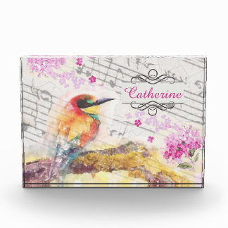 Vintager Vogel auf Baumrosa Blume entmutigen Fotoblock