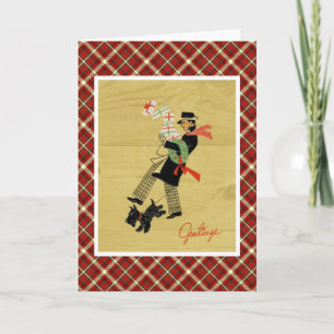 Vintager Weihnachtsterrier-Hund und Mann mit Feiertagskarte