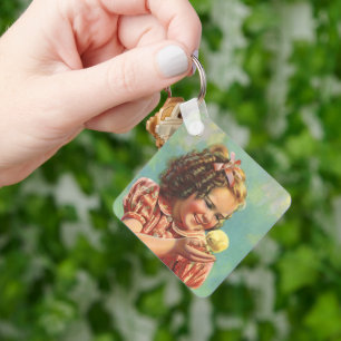 Vintages Kind, glückliches Lächeln, Mädchen mit Ba Schlüsselanhänger