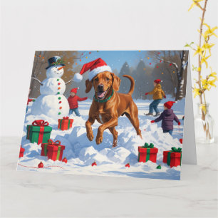 Vizsla läuft im Schnee mit Weihnachtsmütze Karte