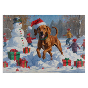 Vizsla läuft in Snow mit Weihnachtshut Schneidebrett