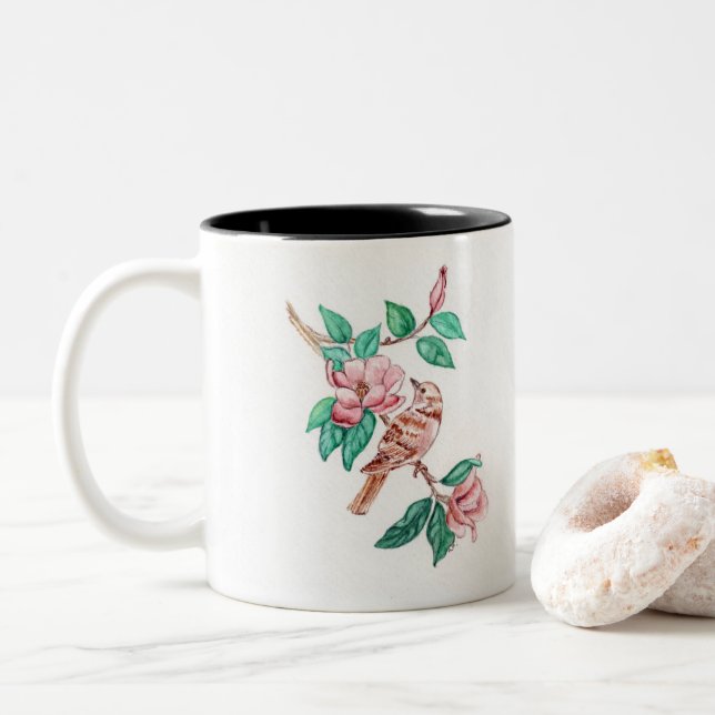 Vogel blüht auf einer Tasse (Mit Donut)