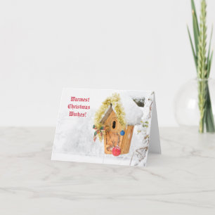 Vogelhaus mit Schnee und Weihnachtsdekorationen Karte