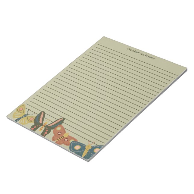 Volkskunst-Motten, Schmetterlinge, die von Grün um Notizblock (angewinkelt)