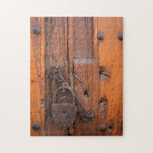 Vorhängeschloss an Holztür Puzzle