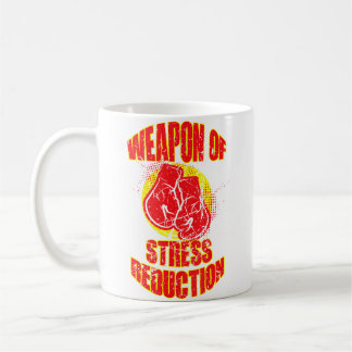 Waffe zur Stressreduzierung und Boxhandschuhe für Kaffeetasse