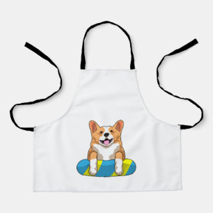 Walisischer Corgi im Schwimmen mit Brett Schürze