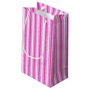 Warme, rosa und weiße Streifen aus Süßigkeiten Kleine Geschenktüte