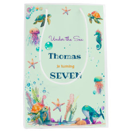 Wasserfarbe unterhalb des Kindergeburtstags Mittlere Geschenktüte