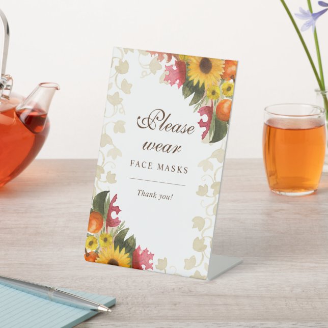 Wasserfarbenfall-Blume tragen Sie bitte Gesichtsma Sockelschild (In SItu)