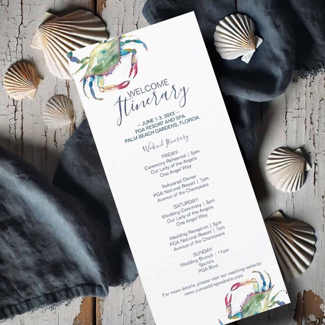 Wasserfarbenkrabben (Flat lay of a watercolor crab wedding itinerary card featuring a blue crab illustration)