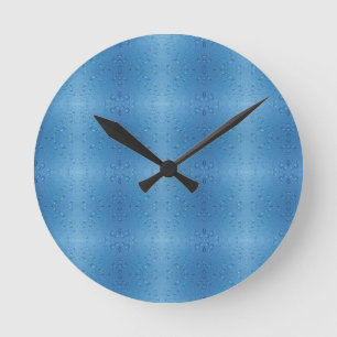 Wassertropfen gegen blauen Himmel Runde Wanduhr