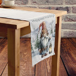 Watercolor Winter Christmas Gnome Mittelgroßer Tischläufer<br><div class="desc">Fügen Sie Ihrer Wohngestaltung eine festliche und bezaubernde Touch in dieser Urlaubssaison mit einem Watercolor Winter Weihnachtsgottesläufer hinzu. Der Tischläufer-Entwurf zeigt ein fröhliches Weihnachtsgnom mit einer hellen Laterne mit einem Berwaldhintergrund mit fallendem Schnee. Zusätzliche Wohngestaltung für Ferien mit diesem Design.</div>
