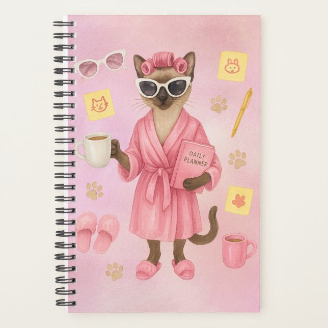 Weibliche Katze hält Terminkalender  Planer (Vorderseite)