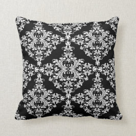 Weibliches Weiß auf schwarzem Damast Kissen
