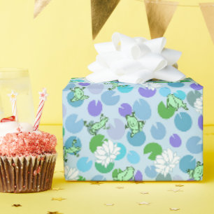 Weiche grüne Frösche und Lily Pads auf hellblauen Geschenkpapier