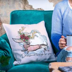 Weihnachten Dachschund durch den schneefestlichen  Kissen