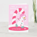 Weihnachten für Little Sister Ice Skaten Snowman<br><div class="desc">Schicken Sie einer kleinen Schwester eine fröhliche und festliche Weihnachtskarte in Rosa mit einem glücklichen Eis-Skaten-Schneemann mit einem bunten Bonbonbon und Schneeflocken auf einem hellrosa Hintergrund. Schneemann mit Höflichkeit Hübscher Grafik.</div>