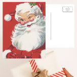 Weihnachten, Jolly Winking Weihnachtsmann Feiertagspostkarte<br><div class="desc">Vintage Illustration Weihnachtsfeierdesign mit einem glücklichen,  fröhlichen Weihnachtsmann,  der einen Hut trägt und zwinkert,  als ob er ein Geheimnis hätte. Ho,  ho,  ho,  frohe Weihnachten!</div>