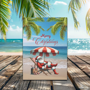 Weihnachten mit Santa unter einem Strandsonnenschi