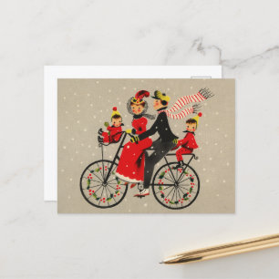 Weihnachtliche Retro-Familie beim Radfahren Feiertagspostkarte