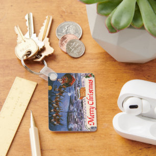 Weihnachtlicher Weihnachtsmann, der mit seinem Sch Schlüsselanhänger