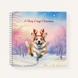 Weihnachts-Corgi-Rentierfischer springen im Schnee Notizbuch
