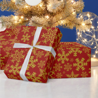 Weihnachts-Gold-Schneeflocken auf rotem Hintergrun Geschenkpapier