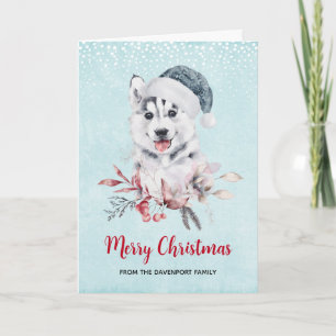 Weihnachts-Husky-Hund in einer Weihnachtsmannmütze Karte