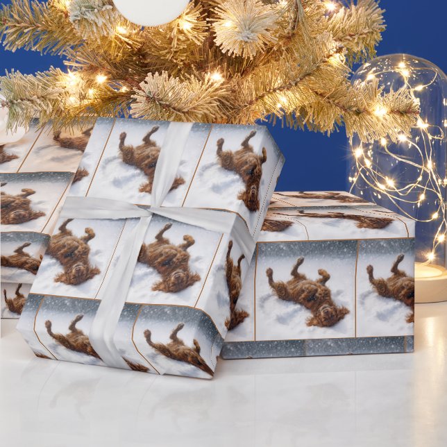 Weihnachts-Irish-Setter macht einen Schneengel Geschenkpapier (Feiertage)