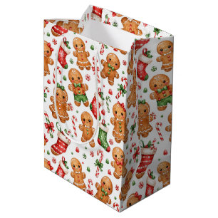 Weihnachts-Lebkuchenjunge und -Mädchen mit Strümpf Mittlere Geschenktüte