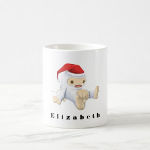 Weihnachts-Monster-Puppe mit roter Weihnachtsmannm Tasse