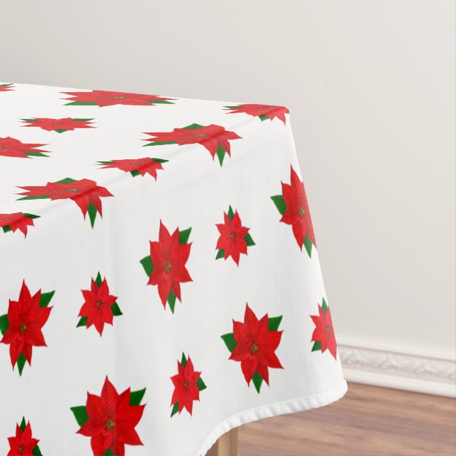 Weihnachts-Poinsettia-Blume auf White Tableclout Tischdecke (Beispiel)