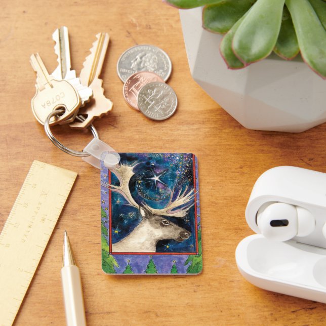 Weihnachts-Rentier am Abend mit einem Shining-Star Schlüsselanhänger (Schreibtisch)