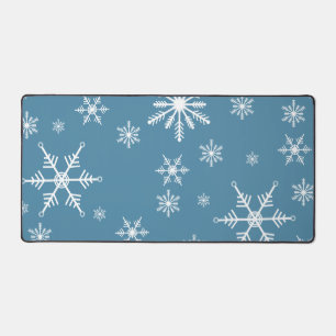 Weihnachts-Schneeflocke auf blau Schreibtischunterlage