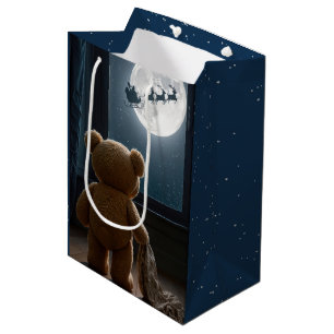 Weihnachts-Teddybär beobachtet Santa Mittlere Geschenktüte