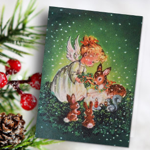 Weihnachts-vintage-Engelsmädchen füttert Tiere Feiertagskarte