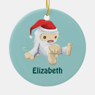 Weihnachts-Yeti-Puppe Eine Weihnachtsmannmütze tra Keramik Ornament