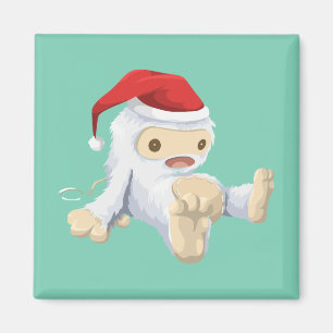 Weihnachts-Yeti-Puppe Eine Weihnachtsmannmütze tra Magnet