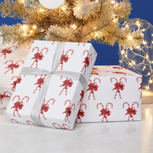 Weihnachts-Zuckerrohre mit Schleifen gebunden Geschenkpapier