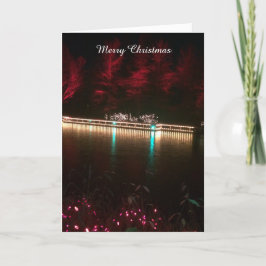 Weihnachtsbeleuchtung und farbenfrohe Bäume Feiertagskarte