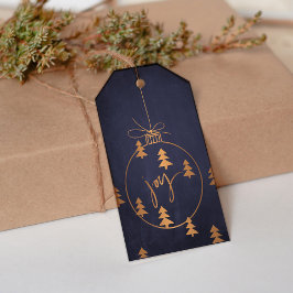 Weihnachtsdekor aus Gold und Bäume auf der Dunklen Geschenkanhänger